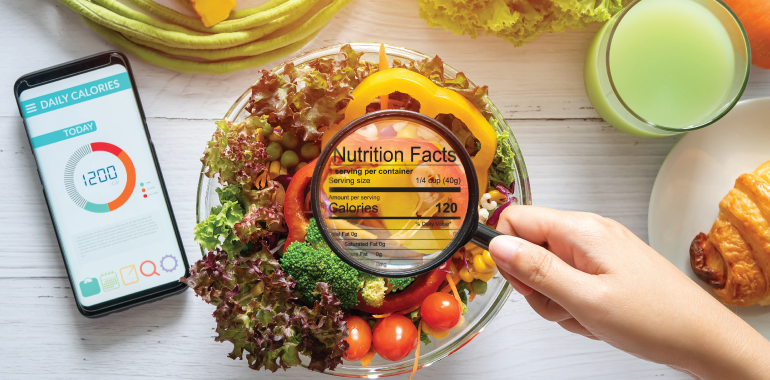 tomato with nutritional fact label and finger pointing